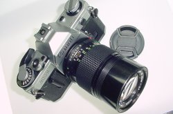 Canon AE-1 35mm Film SLR Manual Camera + Canon 135mm F/3.5 FD Lens Canon AE-1 35mm Film SLR Manual Camera + Canon 135mm F/3.5 FD Lens