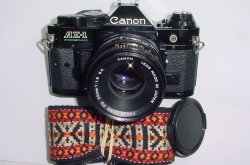Canon AE-1 Program 35mm SLR Film Manual Camera + Canon 50/1.8 FD Lens in Black