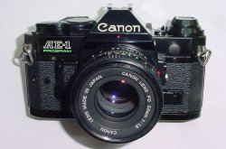 Canon AE-1 Program 35mm SLR Film Manual Camera + Canon 50/1.8 FD Lens in Black