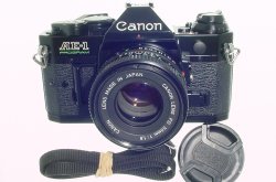 Canon AE-1 Program 35mm SLR Film Manual Camera + Canon 50/1.8 FD Lens in Black