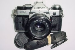 Canon AE-1 Program 35mm SLR Film Manual Camera with Canon 50mm F/1.8 FD Lens