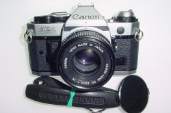 Canon AE-1 Program 35mm SLR Film Manual Camera with Canon 50mm F/1.8 FD Lens Canon AE-1 Program 35mm SLR Film Manual Camera with Canon 50mm F/1.8 FD Lens