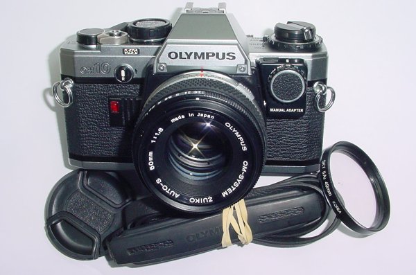 Olympus OM10 35mm Film SLR Manual Camera with Olympus 50/1.8 Zuiko Lens + MA